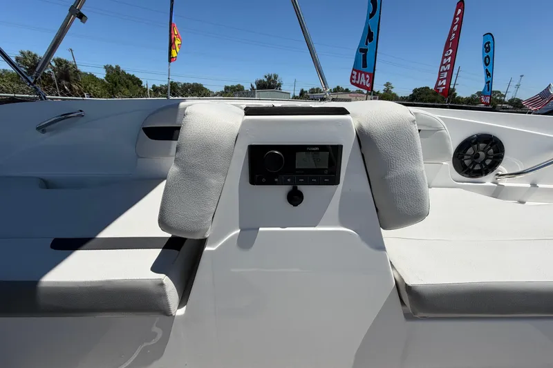 Slide: The Image of Interior view of 2022 Hurricane SunDeck Sport 185 OB boat with seating and audio system. - 32