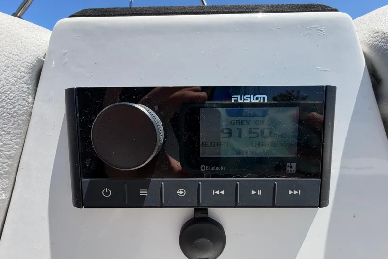 Slide: The Image of Fusion stereo system on 2022 Hurricane SunDeck Sport 185 OB boat dashboard. - 33