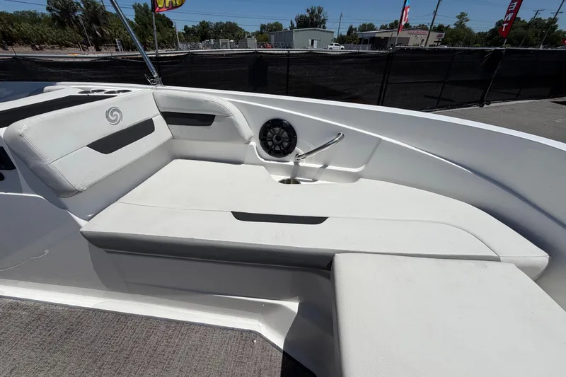 Slide: The Image of 2022 Hurricane SunDeck Sport 185 OB boat interior with white seating and speaker. - 38