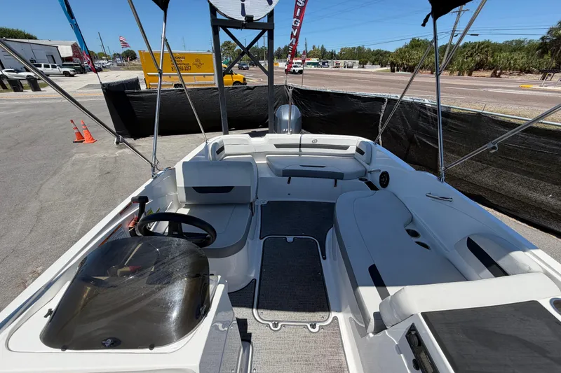 Slide: The Image of 2022 Hurricane SunDeck Sport 185 OB boat interior with seating and steering wheel. - 44