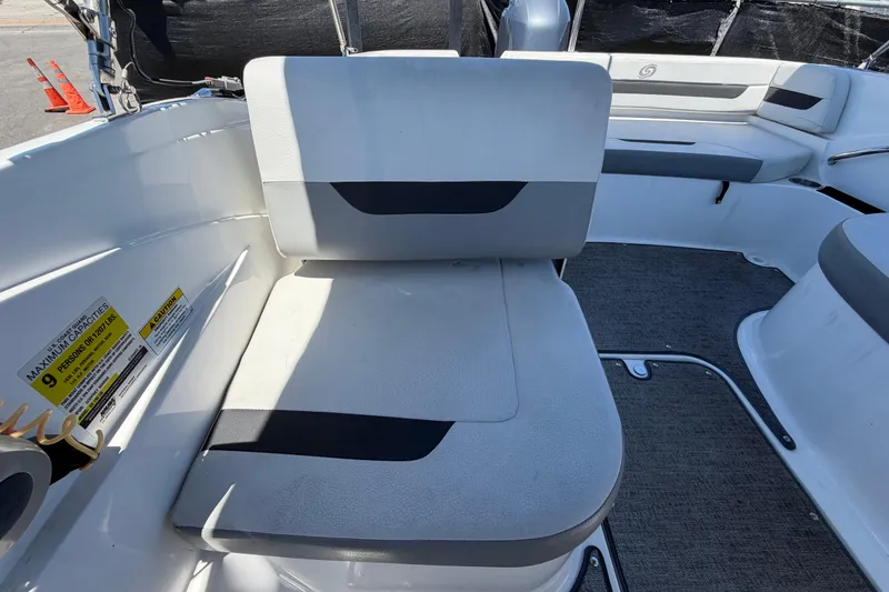 Slide: The Image of 2022 Hurricane SunDeck Sport 185 OB boat interior with seating and capacity label. - 46