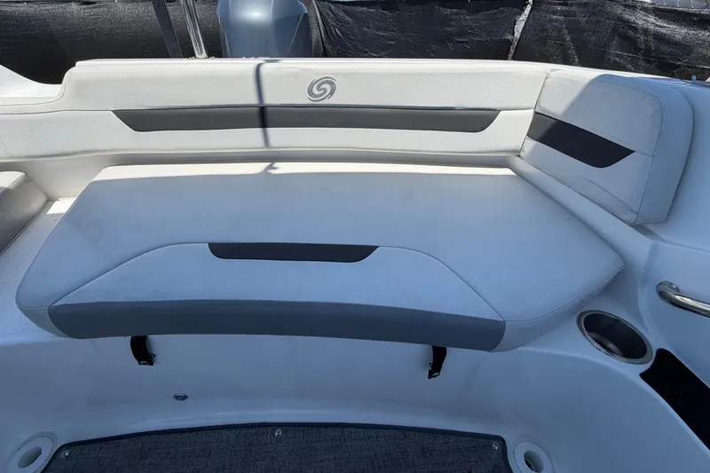 Slide: The Image of 2022 Hurricane SunDeck Sport 185 OB boat seating area with cushioned bench and cup holder. - 52