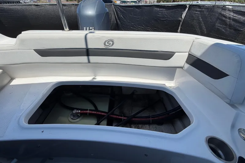 Slide: The Image of 2022 Hurricane SunDeck Sport 185 OB boat interior with open storage compartment. - 53