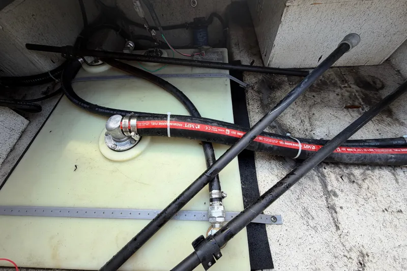 Slide: The Image of Fuel system components in a 2022 Hurricane SunDeck Sport 185 OB boat. - 54