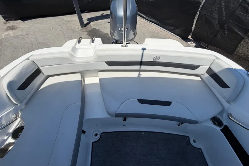Slide: The Image of 2022 Hurricane SunDeck Sport 185 OB boat interior with seating and motor. - 55