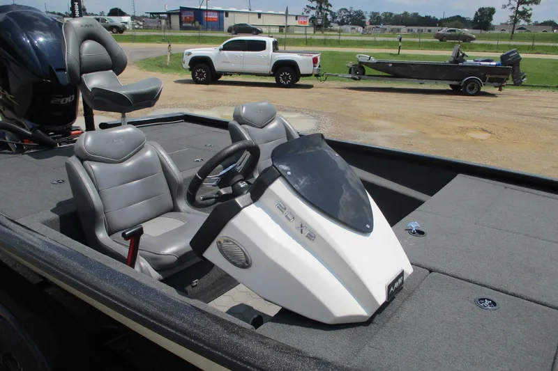 Slide: The Image of 2021 Avid 20XB boat interior with steering wheel and seating. - 13