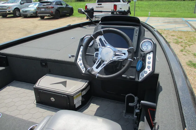 Slide: The Image of Interior of a 2021 Avid 20XB boat showing steering wheel and dashboard controls. - 8