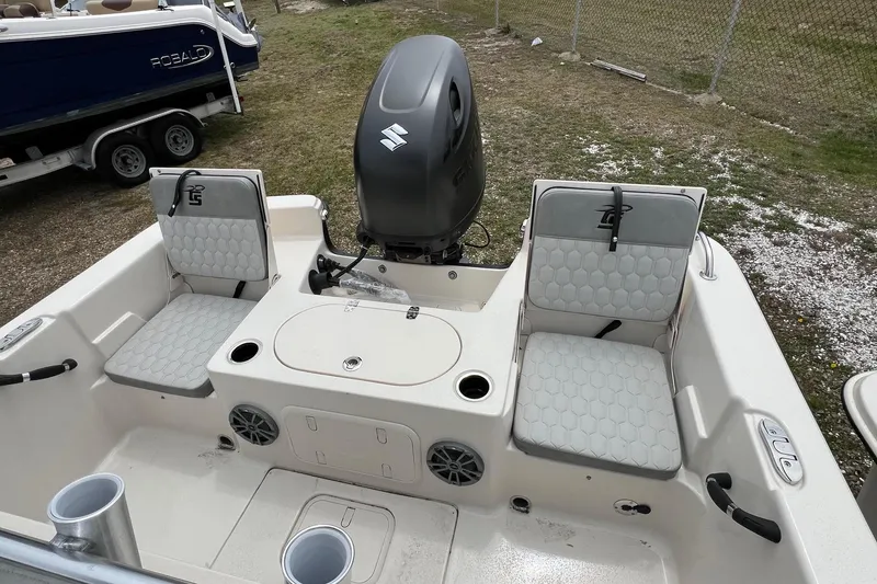 Slide: The Image of 2026 Carolina Skiff 21 LS boat interior with seating and motor, showcasing modern design. - 12