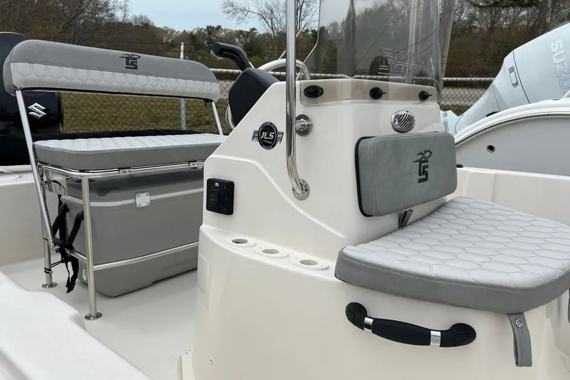 Slide: The Image of 2026 Carolina Skiff 21 LS boat interior with seating and console details. - 13
