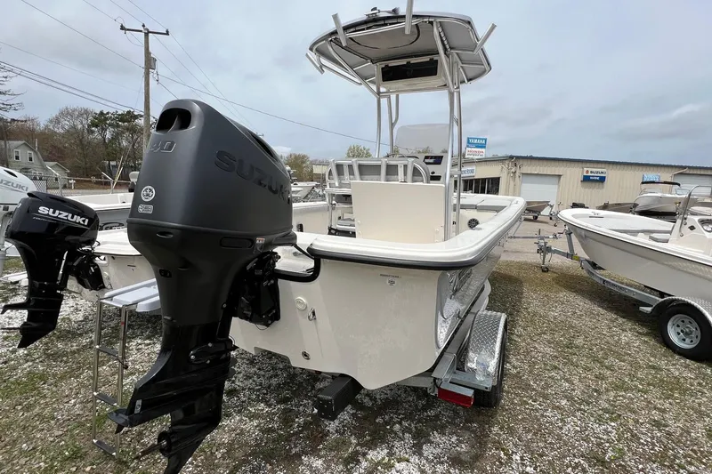 Slide: The Image of 2026 Carolina Skiff 21 LS boat with Suzuki outboard motor on trailer. - 15
