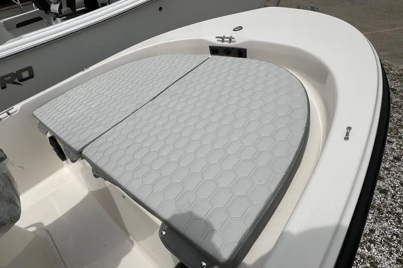 Slide: The Image of 2026 Carolina Skiff 21 LS boat with cushioned seating and hexagonal pattern design. - 19