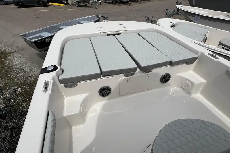 Slide: The Image of 2026 Carolina Skiff 21 LS boat interior with cushioned seating and storage compartments. - 21