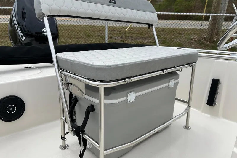 Slide: The Image of 2026 Carolina Skiff 21 LS boat seat with storage and Suzuki engine. - 22