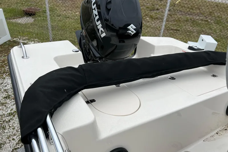Slide: The Image of 2026 Carolina Skiff 21 LS boat with Suzuki outboard motor, rear deck view. - 24