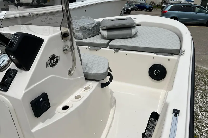 Slide: The Image of 2026 Carolina Skiff 21 LS boat interior with seating and control panel. - 25
