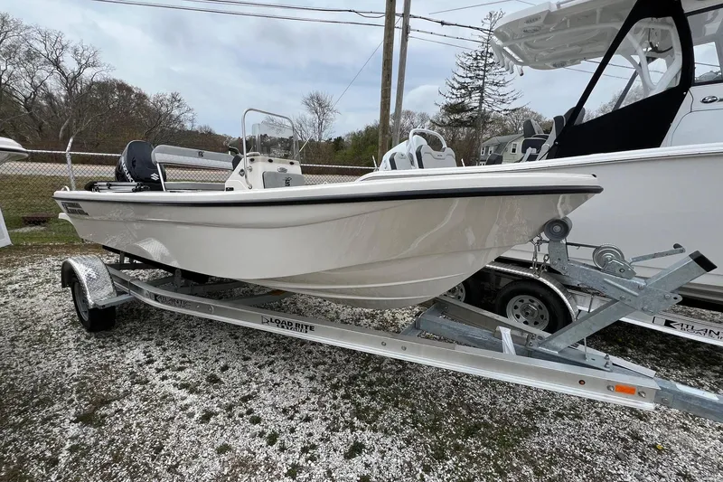 Slide: The Image of 2026 Carolina Skiff 21 LS boat on trailer, parked outdoors. - 3