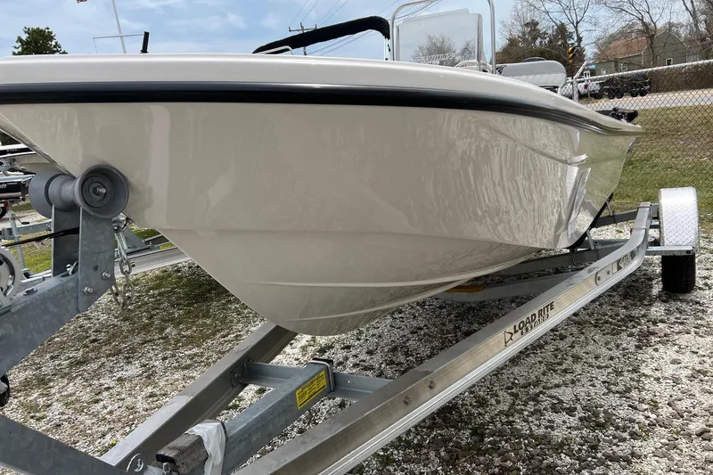 Slide: The Image of 2026 Carolina Skiff 21 LS boat on trailer, side view. - 4