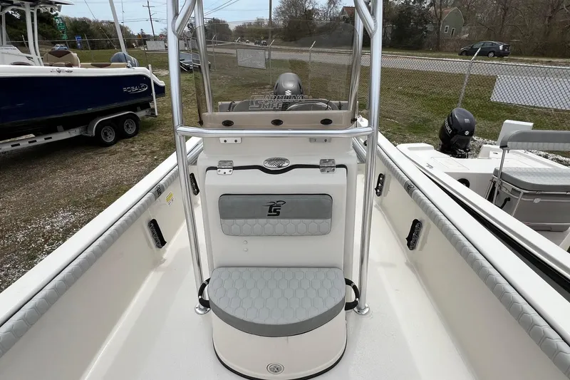 Slide: The Image of 2026 Carolina Skiff 21 LS boat interior with seating and console view. - 8
