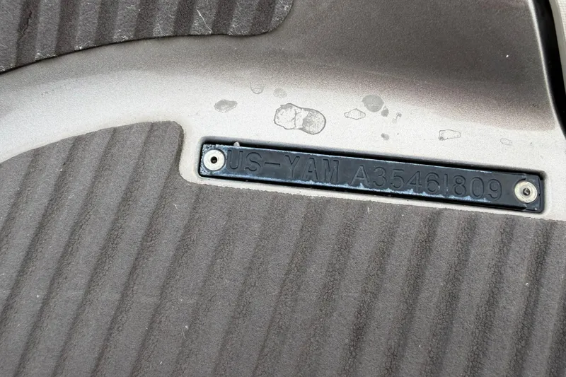 Slide: The Image of 2009 Yamaha WaveRunner FX Cruiser SHO identification plate on textured surface. - 10