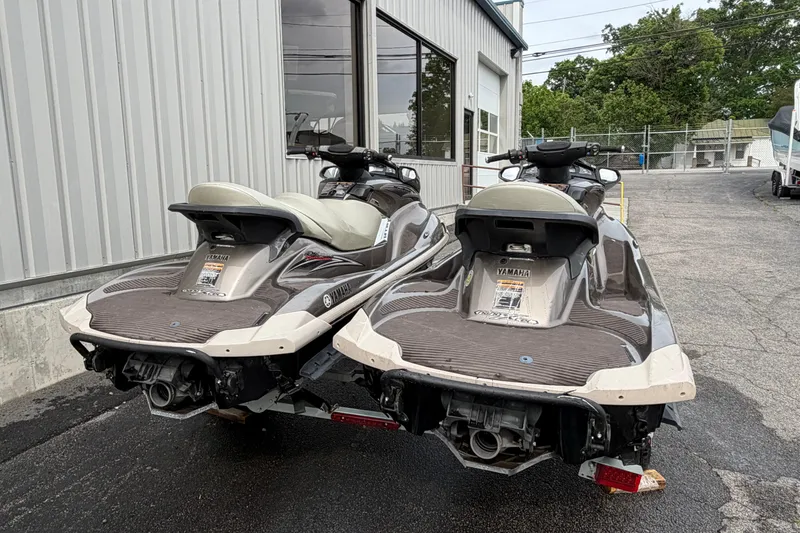 Slide: The Image of Two 2009 Yamaha WaveRunner FX Cruiser SHO jet skis parked outside a building. - 4