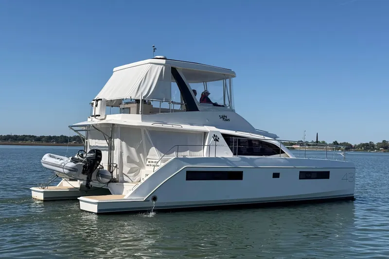 Slide: The Image of 2021 Leopard 43 Powercat yacht on calm water, featuring sleek design and modern amenities. - 2