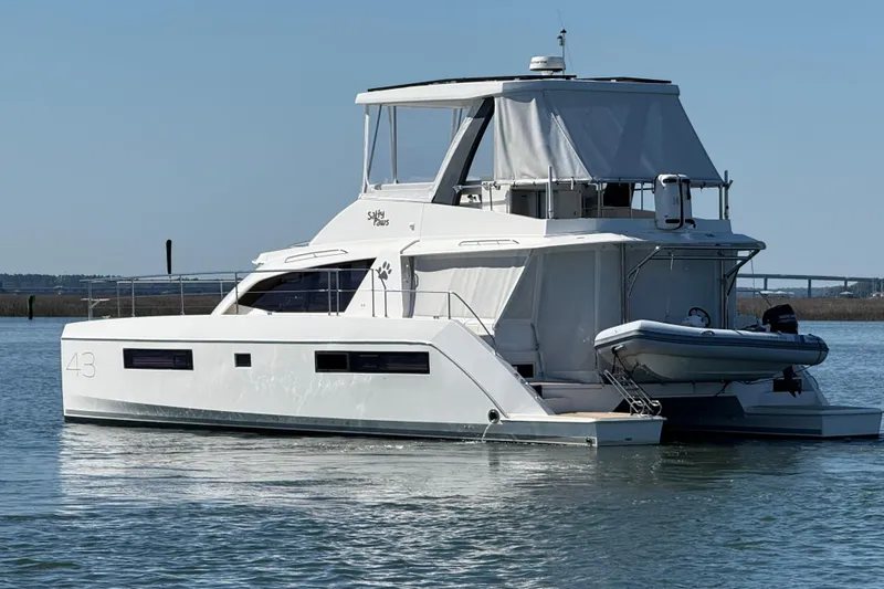 Slide: The Image of 2021 Leopard 43 Powercat yacht on calm water, featuring sleek design and modern amenities. - 3