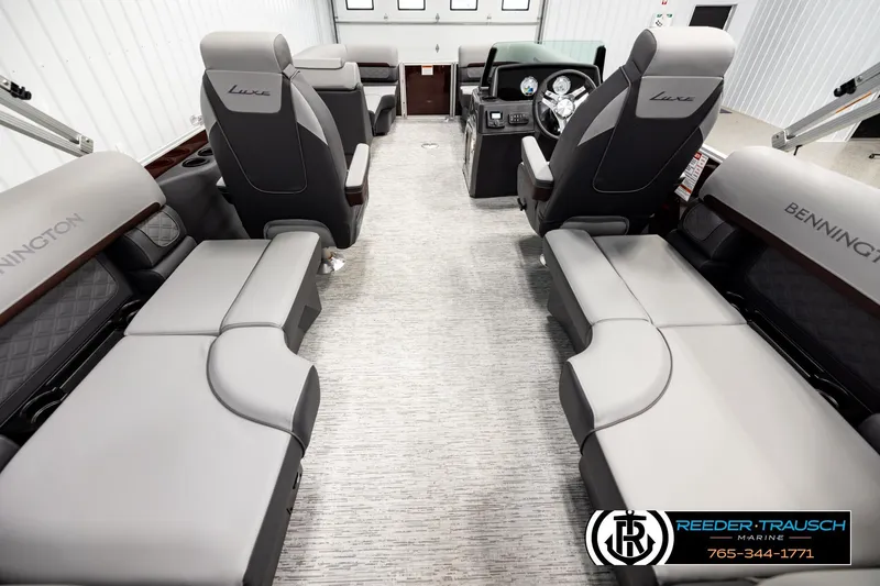 Slide: The Image of 2026 Bennington S20 Luxe interior with luxurious seating and modern dashboard design. - 16