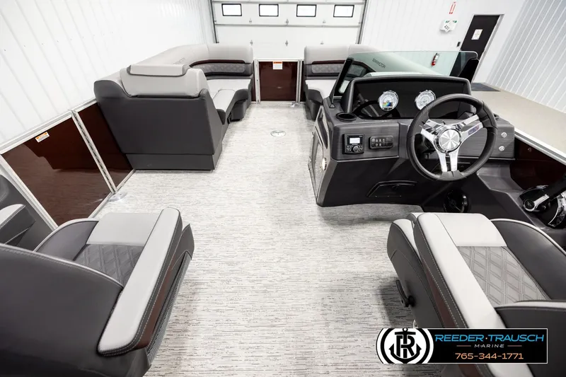 Slide: The Image of Interior of 2026 Bennington S20 Luxe pontoon boat with modern seating and steering console. - 17