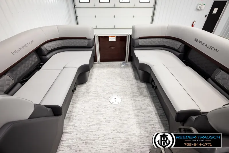 Slide: The Image of 2026 Bennington S20 Luxe pontoon boat interior with plush seating and modern design. - 18