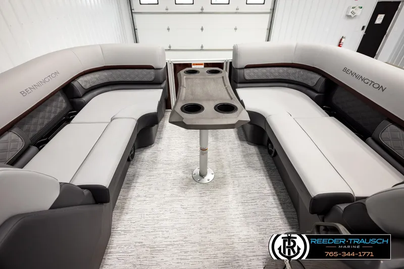 Slide: The Image of Interior of 2026 Bennington S20 Luxe pontoon boat with plush seating and central table. - 19