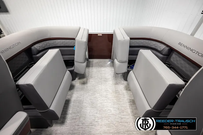 Slide: The Image of 2026 Bennington S20 Luxe boat interior with plush gray seating and elegant design. - 22