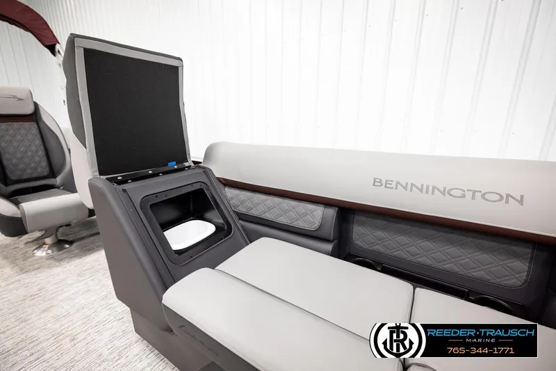 Slide: The Image of 2026 Bennington S20 Luxe boat interior with luxurious seating and storage compartment. - 24