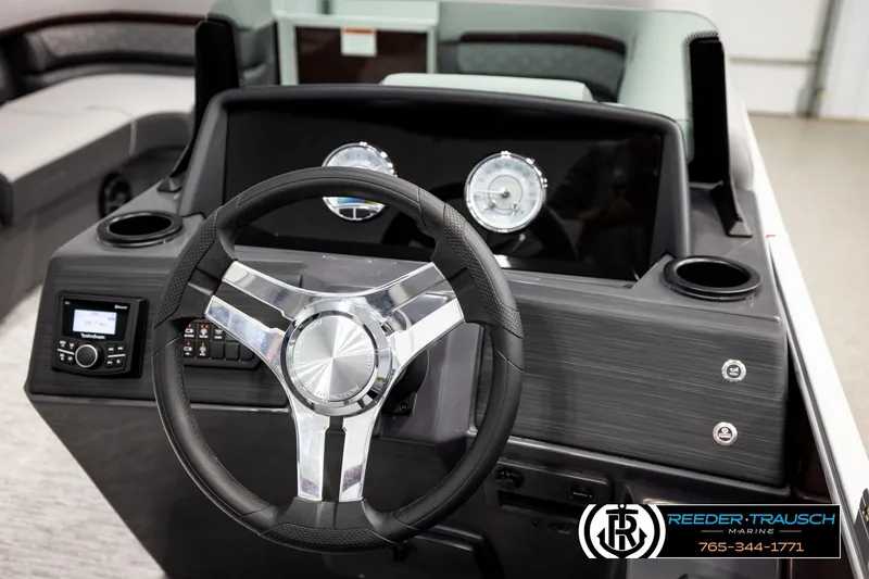 Slide: The Image of Steering console of 2026 Bennington S20 Luxe pontoon boat with modern controls and gauges. - 25