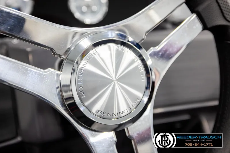 Slide: The Image of Close-up of 2026 Bennington S20 Luxe steering wheel with chrome finish. - 27