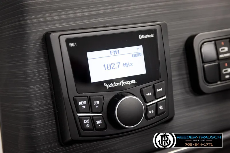 Slide: The Image of Close-up of a Rockford Fosgate PMX-1 stereo system in a 2026 Bennington S20 Luxe. - 28
