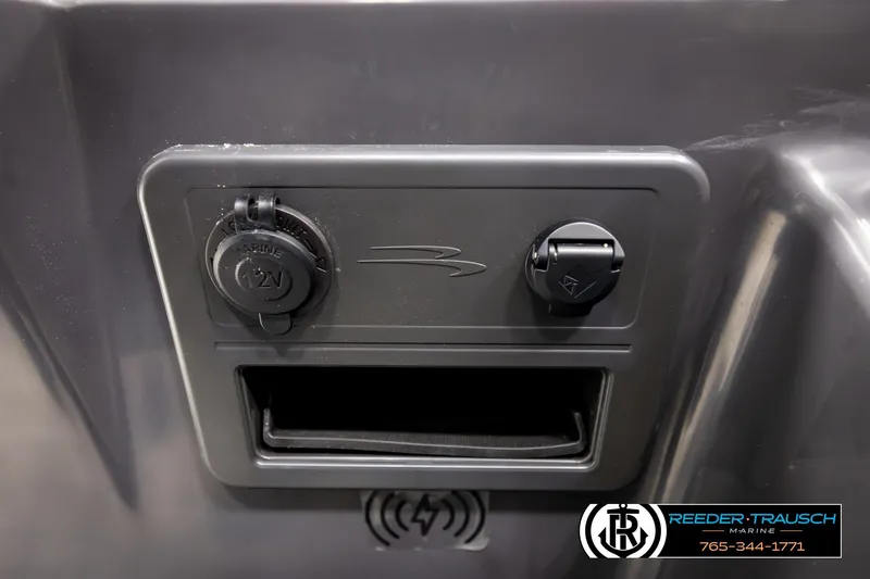 Slide: The Image of Control panel of 2026 Bennington S20 Luxe boat with 12V outlet and USB port. - 32