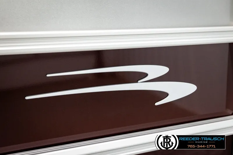 Slide: The Image of 2026 Bennington S20 Luxe logo on a sleek brown and silver boat exterior. - 43