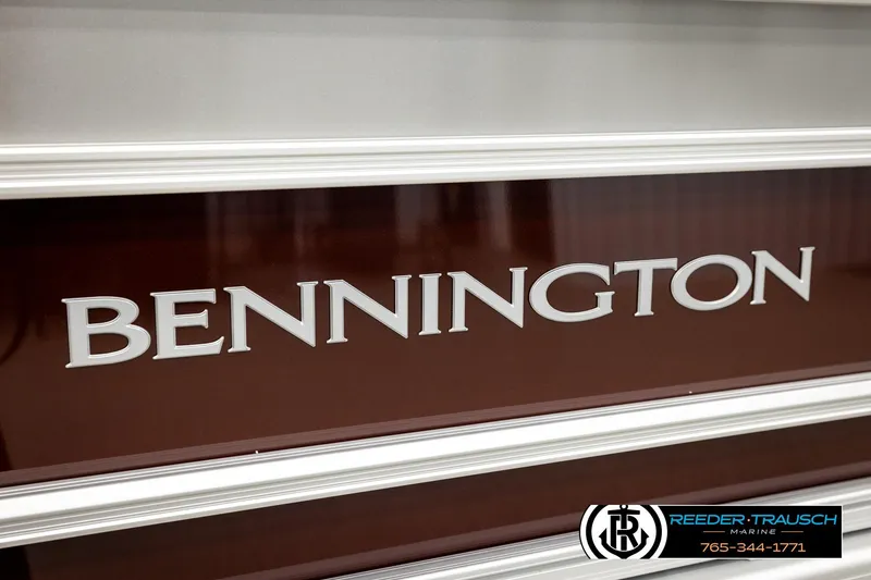 Slide: The Image of Bennington S20 Luxe 2026 boat logo on a sleek brown surface. - 44