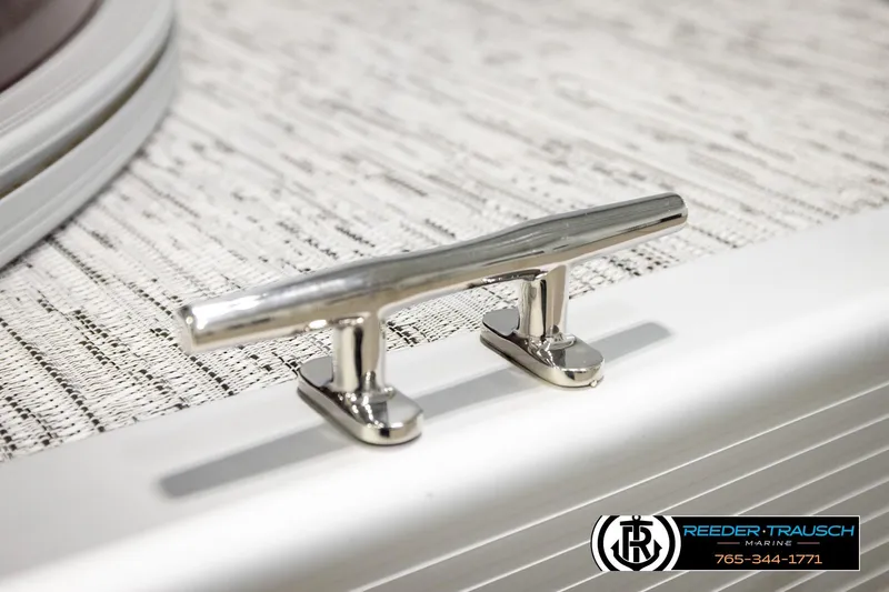 Slide: The Image of Chrome cleat on 2026 Bennington S20 Luxe boat deck, Reeder-Trausch Marine logo visible. - 47