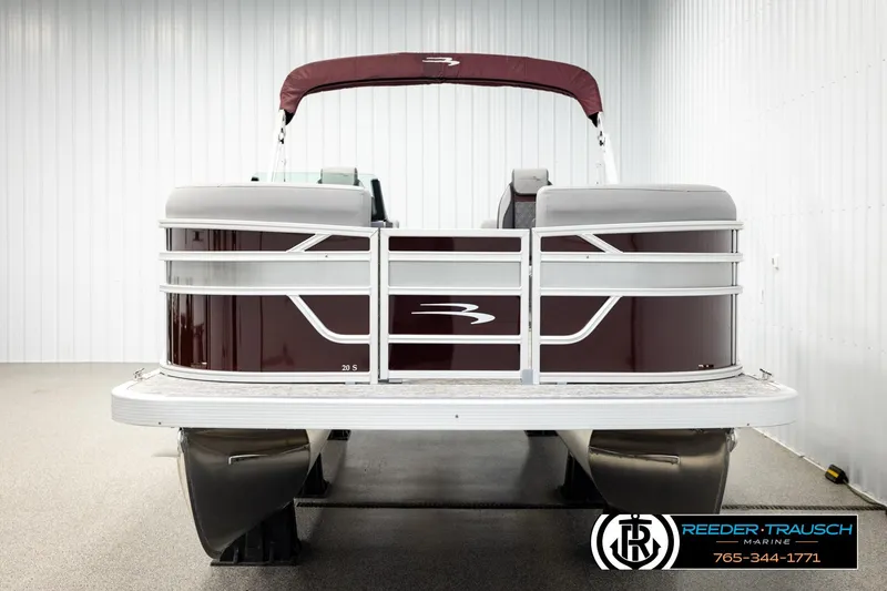 Slide: The Image of 2026 Bennington S20 Luxe pontoon boat in showroom, rear view. - 8