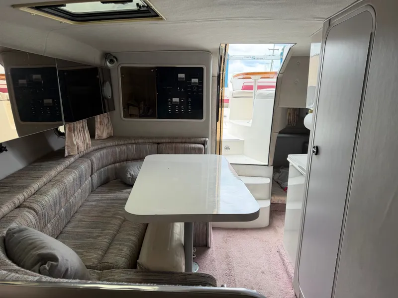 Slide: The Image of Interior of a 1990 Chaparral Signature 30 boat with seating area and table. - 17