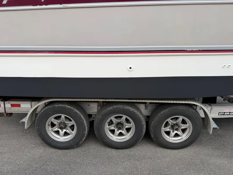 Slide: The Image of 1990 Chaparral Signature 30 boat on trailer. - 24