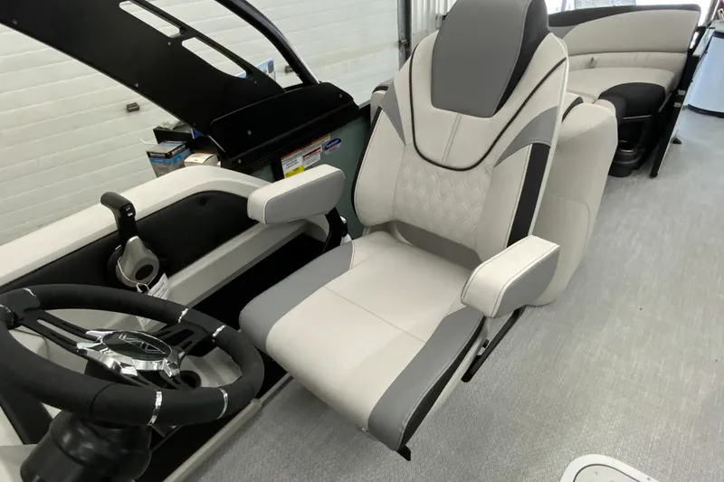Slide: The Image of Luxurious interior of 2026 Avalon LSZ 2385 QL pontoon boat with plush captain's chair. - 20