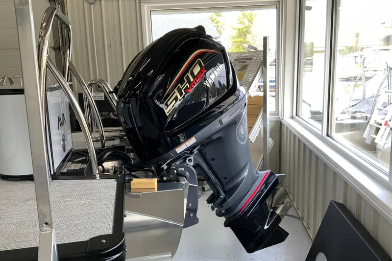 Slide: The Image of 2026 Avalon LSZ 2385 QL boat with Yamaha SHO outboard motor in showroom. - 24