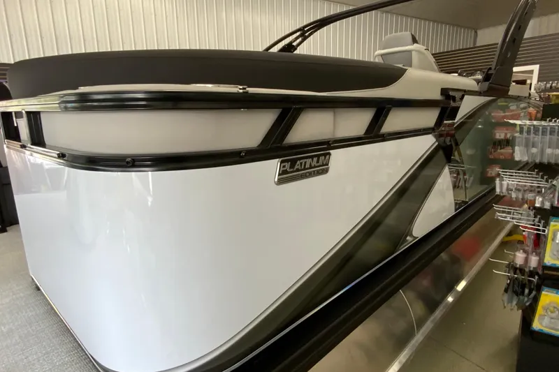 Slide: The Image of 2026 Avalon LSZ 2385 QL Platinum Edition pontoon boat in showroom display. - 26
