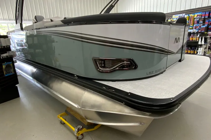 Slide: The Image of 2026 Avalon LSZ 2385 QL pontoon boat displayed indoors. - 28