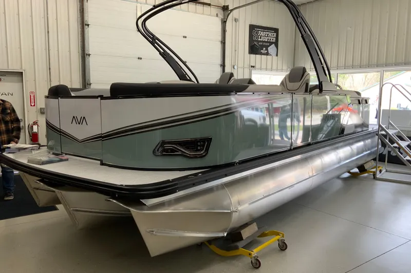 The Image of 2026 Avalon LSZ 2385 QL pontoon boat in showroom, sleek design and modern features. - 9