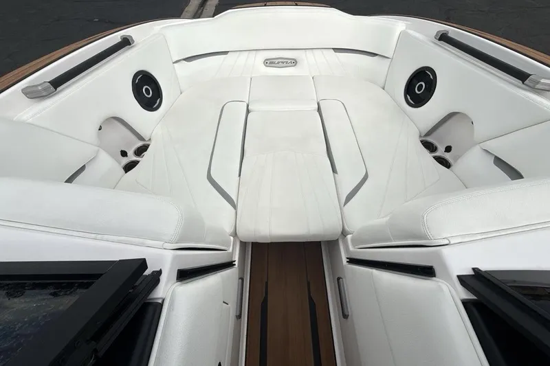 Slide: The Image of 2024 Supra SA 550 boat interior with white seating and integrated speakers. - 11