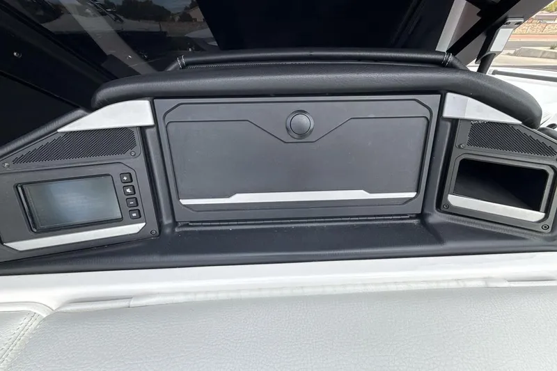 Slide: The Image of 2024 Supra SA 550 dashboard with control panel and storage compartments. - 18