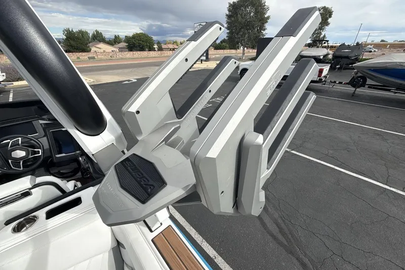 Slide: The Image of 2024 Supra SA 550 boat tower detail in a parking lot setting. - 22